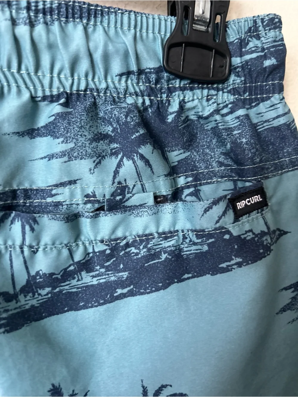 Rip Curl boy’s Blue Palm-Print Swim Trunks, Sz S